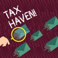 Text sign showing Tax Haven. Conceptual photo country or independent area where taxes are levied at low rate Magnifying