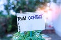 Text sign showing Team Contact. Conceptual photo The interaction of the individuals on a team or group Plain empty paper