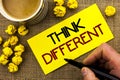 Text sign showing Think Different. Conceptual photo Rethink Change on vision Acquire New Ideas Innovate written on Sticky Note Pap