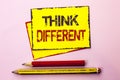 Text sign showing Think Different. Conceptual photo Rethink Change on vision Acquire New Ideas Innovate written on Yellow Sticky N