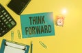 Text sign showing Think Forward. Conceptual photo The act of thinking about and planning for the future Clipboard clips sheet
