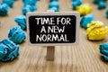 Text sign showing Time For A New Normal. Conceptual photo Make a big dramatic change Replace the expected Paperclip hold written c