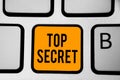 Text sign showing Top Secret. Conceptual photo telling someone important data or information that he cant tell Keyboard orange key Royalty Free Stock Photo