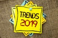 Text sign showing Trends 2019. Conceptual photo Current Movement Latest Branding New Concept Prediction written on Sticky Note Pap