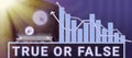 Sign displaying True Or False. Word Written on Decide between a fact or telling a lie Doubt confusion Man With Pad And