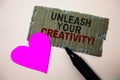 Text sign showing Unleash Your Creativity Call. Conceptual photo Develop Personal Intelligence Wittiness Wisdom Brown paperboard r Royalty Free Stock Photo
