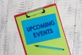Text sign showing Upcoming Events. Conceptual photo the approaching planned public or social occasions Colored clipboard