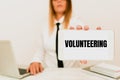 Text sign showing Volunteering. Business showcase Provide services for no financial gain Willingly Oblige Intern