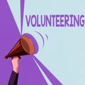 Text sign showing Volunteering. Conceptual photo Provide services for no financial gain Willingly Oblige Hu analysis Hand Holding
