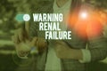 Text sign showing Warning Renal Failure. Conceptual photo stop Filtering Excess Waste Acute Kidney malfunction Woman