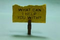 Text sign showing What Can I Help You With question. Conceptual photo Offering assistance Experts advice ideas Paperclip hold torn Royalty Free Stock Photo