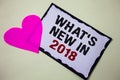 Text sign showing What'S New In 2018. Conceptual photo Year resolution Goals Career achievements Technology Hart love pink white