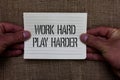 Text sign showing Work Hard Play Harder. Conceptual photo a Balance Life Have a Break Destressing to Relax Man holding piece noteb