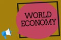 Text sign showing World Economy. Conceptual photo Global Worldwide International markets trade money exchange Megaphone loudspeake Royalty Free Stock Photo