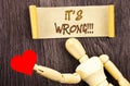 Text sign showing It Is Wrong. Conceptual photo Correct Right Decision To Make Or Mistake Advice written on Sticky Note Love Heart