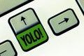 Text sign showing Yolo. Conceptual photo stand for You only live once popular phase among students and teens