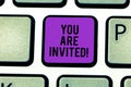 Text sign showing You Are Invited. Conceptual photo Receiving and invitation for an event Join us to celebrate Keyboard Royalty Free Stock Photo