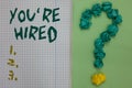 Text sign showing You re are Hired. Conceptual photo New Job Employed Newbie Enlisted Accepted Recruited Notebook paper crumpled p
