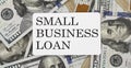 Text SMALL BUSINESS LOAN on dollars background