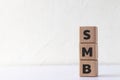 Text SMB on wood cubes. Abbreviation of \'Server Message Block\' or \'Small and medium-sized enterprises