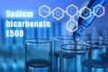 Text Sodium bicarbonate E500 with soda formula and test tubes Royalty Free Stock Photo