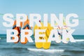 Text spring break and flip-flops on the beach Royalty Free Stock Photo