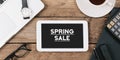 Text Spring Sale on screen of table computer at office desk Royalty Free Stock Photo