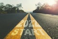 Text start and new year 2022 on long paveway road with sunset Royalty Free Stock Photo