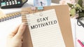 Text Stay motivated on white paper, Royalty Free Stock Photo