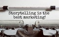 The text Storytelling is the best marketing is typed on paper by an antique typewriter. Vintage inscription, retro style, grunge, Royalty Free Stock Photo