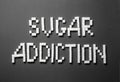 Text SUGAR ADDICTION on dark background