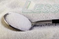 Less text, sugar slide on a spoon, suggesting a diet and health concept