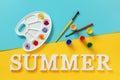 Text Summer, bright colorful flowers on artist palette, brush and gouache on blue yellow background. Creative concept summer Royalty Free Stock Photo