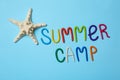 Text SUMMER CAMP made of modelling clay and starfish on color background Royalty Free Stock Photo