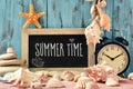 Text summer time in a chalkboard