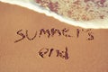 Text summers end written in the sand of a beach Royalty Free Stock Photo