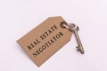 Text on a tag with key - Real estate negotiator Royalty Free Stock Photo