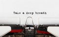 Text Take a deep breath typed on retro typewriter