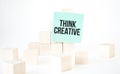 Text Think Creative writing in green card cube ladder. White background. Business concept Royalty Free Stock Photo