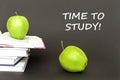 Text time to study, two green apples, open books with concept Royalty Free Stock Photo