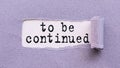 The text TO BE CONTINUED appears on torn lilac paper against a white background