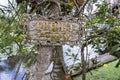 Text toilet on a wooden board in a tropical garden in Bali island, Indonesia