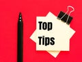 Text Top Tips written on paper notes