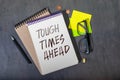 text Tough Times Ahead on black torn paper Royalty Free Stock Photo