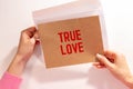 The text True Love appearing behind torn brown paper Royalty Free Stock Photo