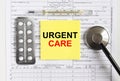 Text Urgent Care on yellow sticker with a stethoscope and pills are on medical documents