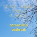 Text of the warning to stay calm and stay at home during the quarantine against the background of leafless tree branches and