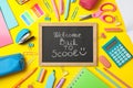 Text Welcome back to school and school supplies on background Royalty Free Stock Photo