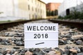 Text welcome 2018 in a lightbox on the railway