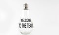 Text WELCOME TO TEAM on the bulb on white background. Business concept Royalty Free Stock Photo